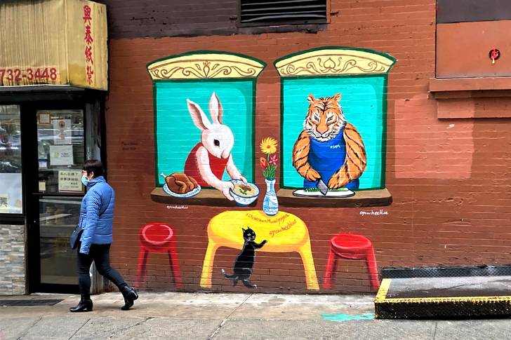 a mural outside a noodle shop